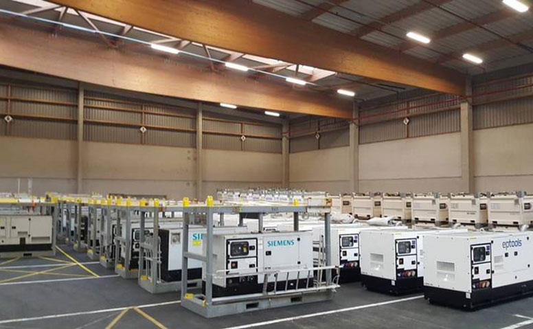 Port Specific Services: Many medium-sized machines are stored in an illuminated large hall